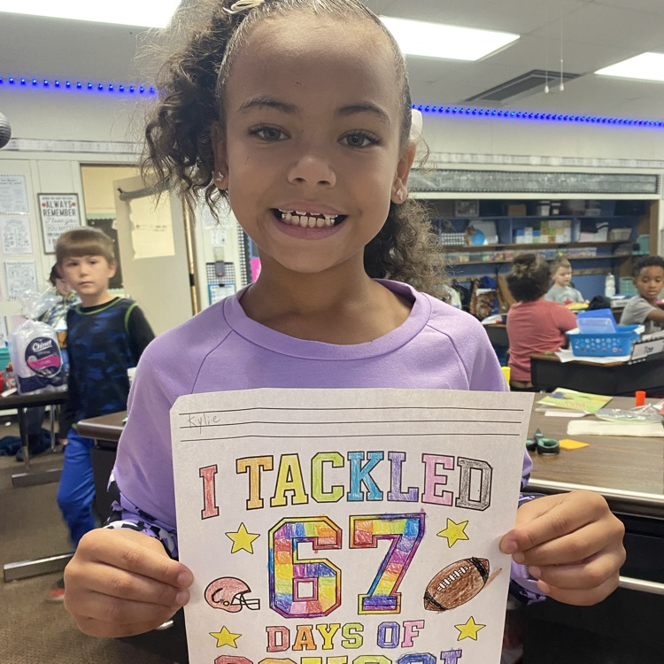 student showing off a 67 days of school coloring page