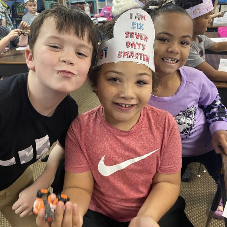 student wearing a headband that says I am 67 days smarter