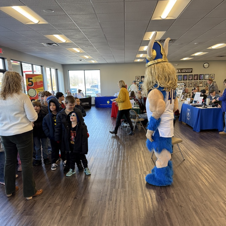 Victor greeting elementary students