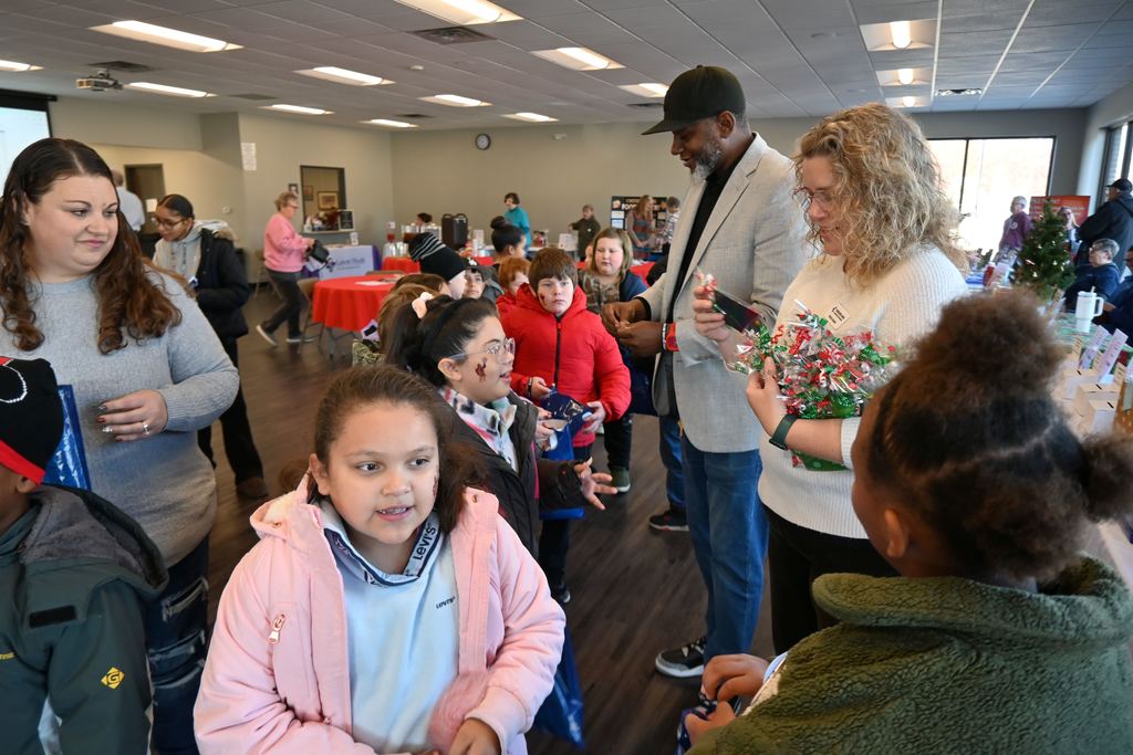 Students receive gifts as they leave.
