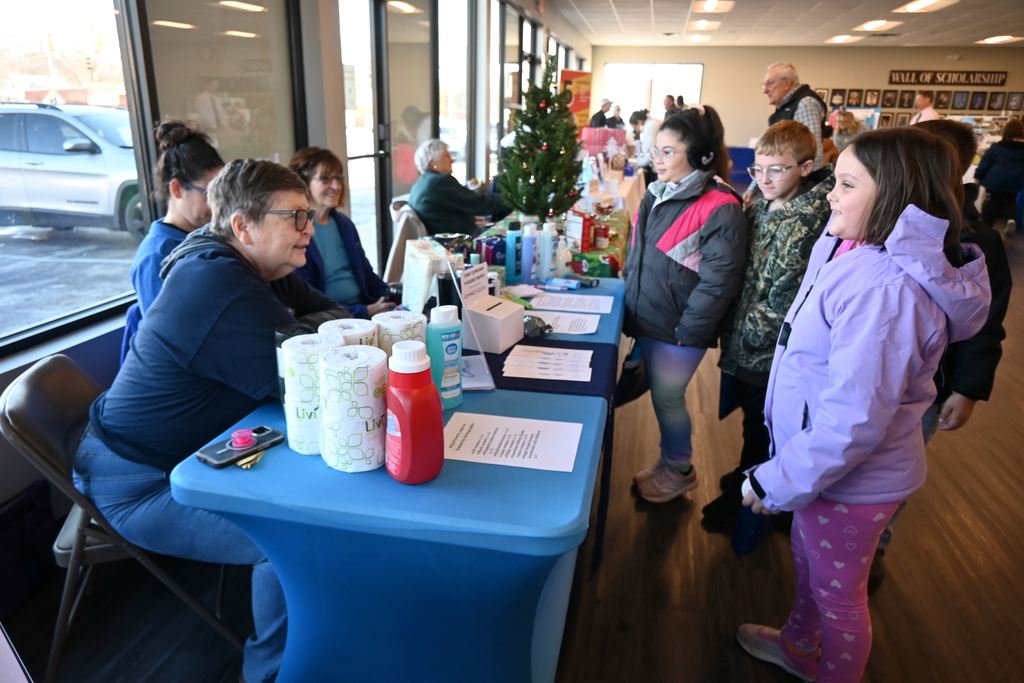 Dtudents visit with people from Care Cupboard Pantry