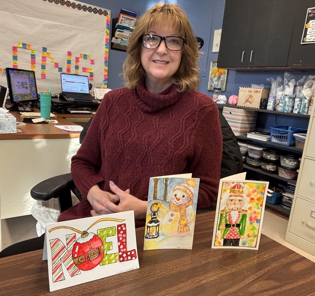 Toni Martinez displays the three cards she won.
