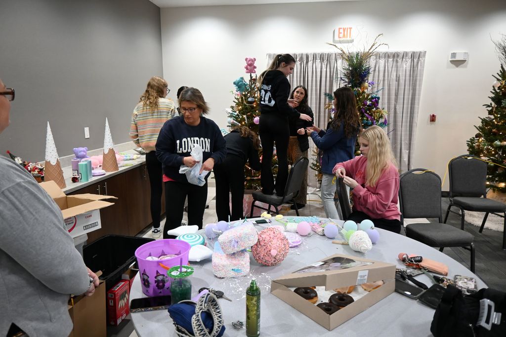 Lincoln students and teachers check out the Stella Wells Christmas trees.