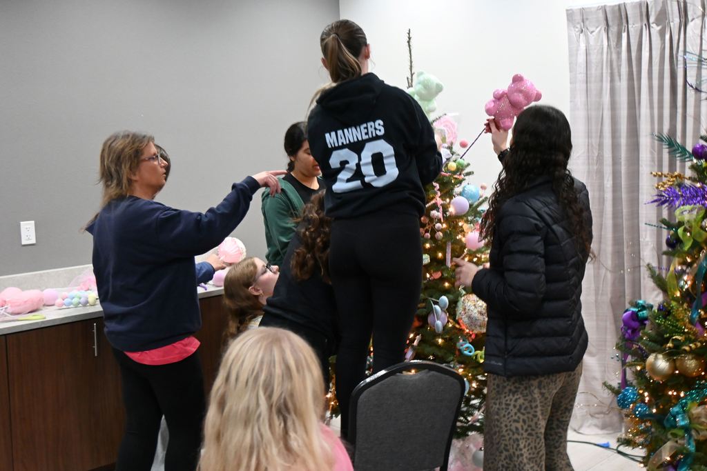 Lincoln students and teachers check out the Stella Wells Christmas trees.