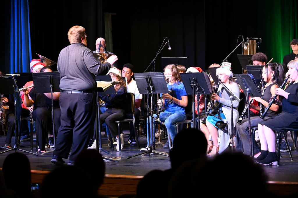 The combination middle school and high school bands play for the audience.