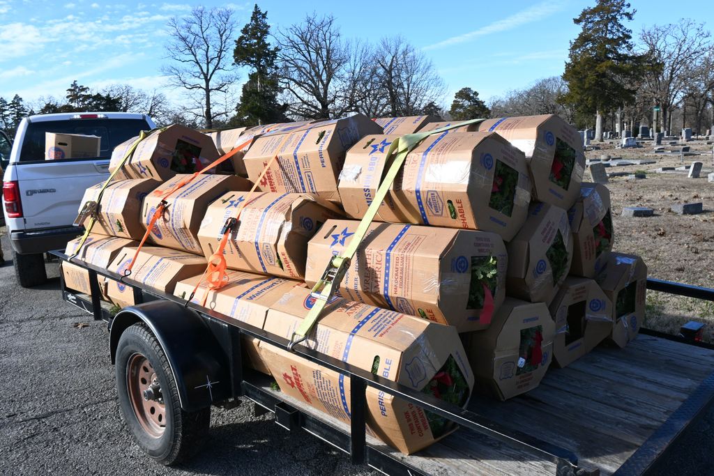 Boxes, containing 12 wreaths each,  were stacked on the back of a trailer and tied down to transport from the museum to Oakwood Cemetery.