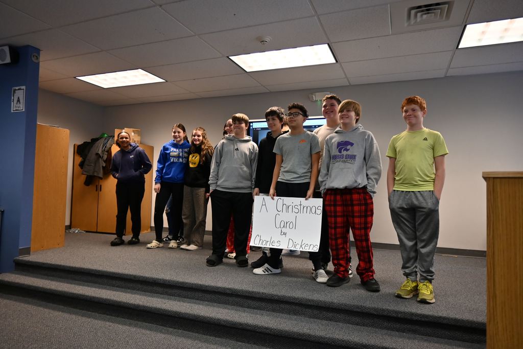 Students perform the play A Christmas Carol.