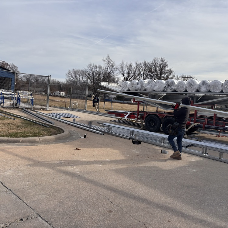 a worker pulls a piece of metal. 