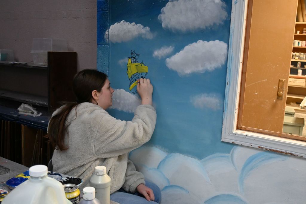 A mural of the Peter Pan ship floating through the sky.