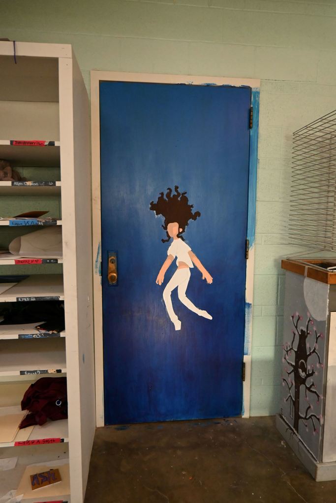 A mural of a person on the back of a door.