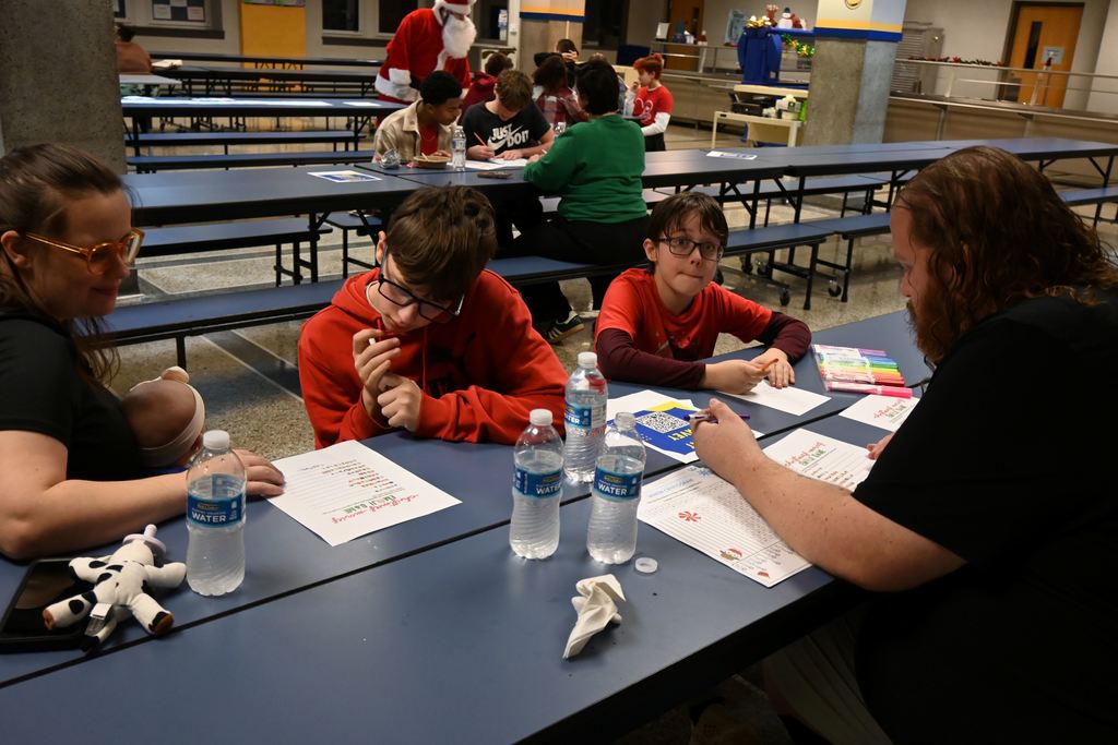 A family has fun with word puzzles.