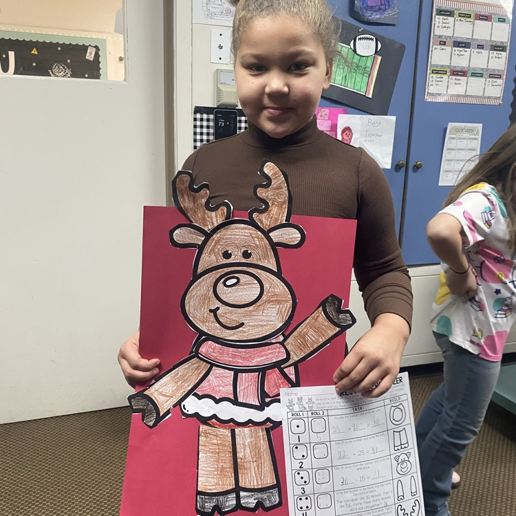 student showing off a math craftivity