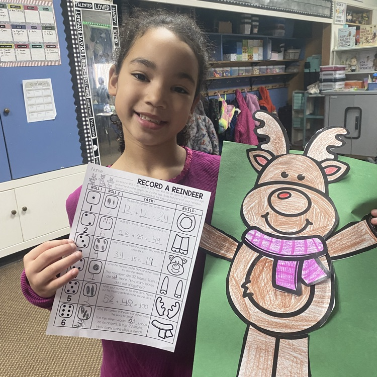 student showing off a math craftivity