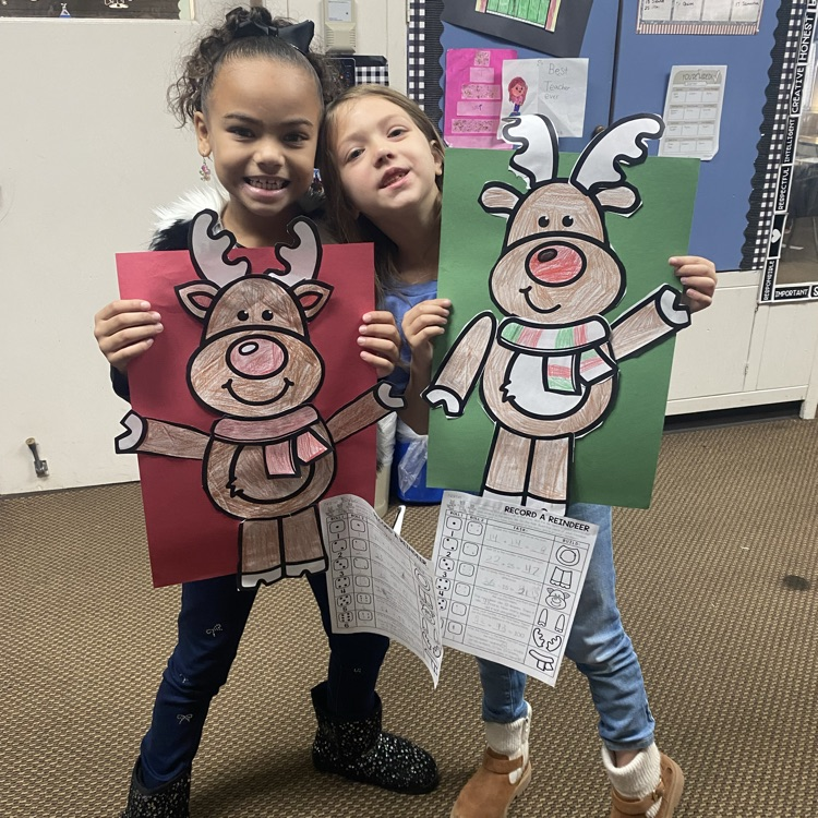 student showing off a math craftivity