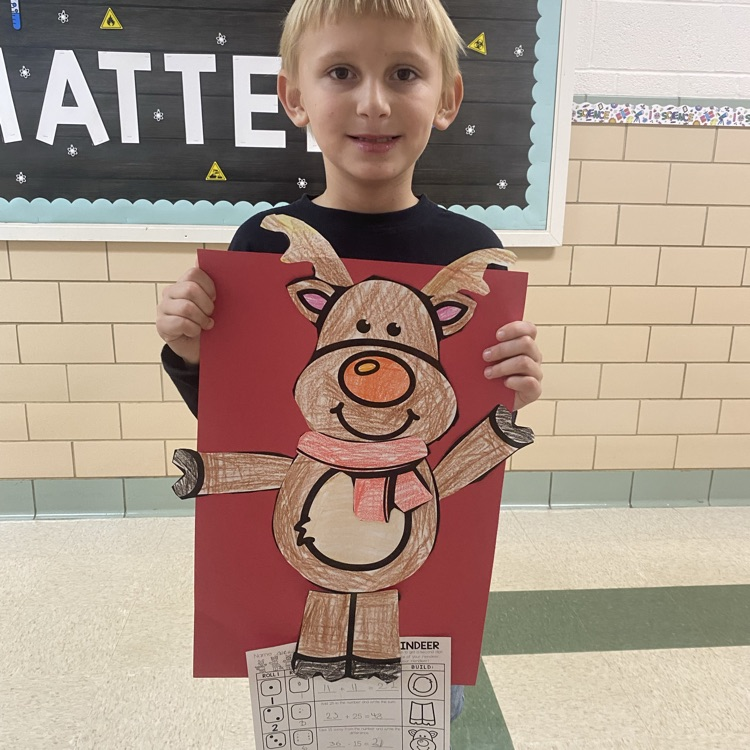 student showing off a math craftivity