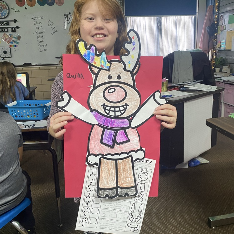 student showing off a math craftivity