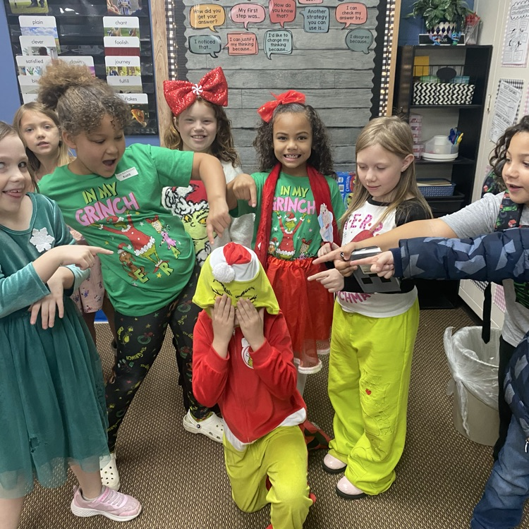 students in Grinch attire