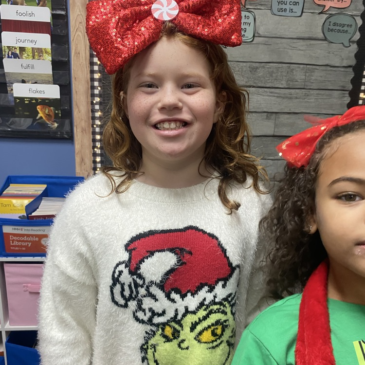 students in Grinch attire