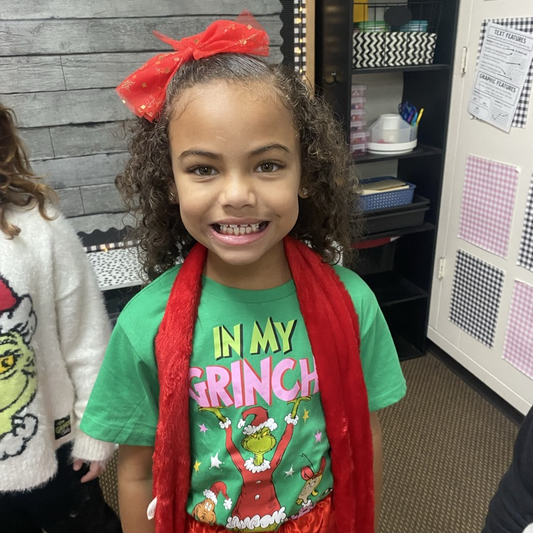 students in Grinch attire