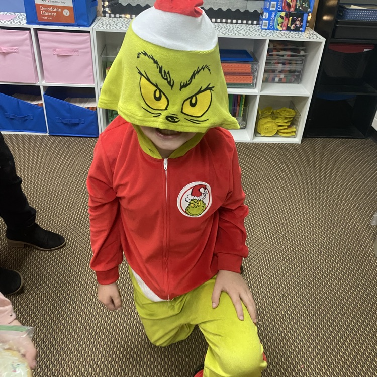 students in Grinch attire