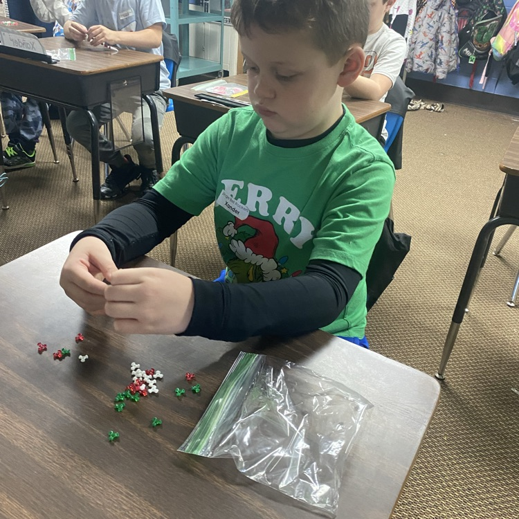student making a beaded candy cane