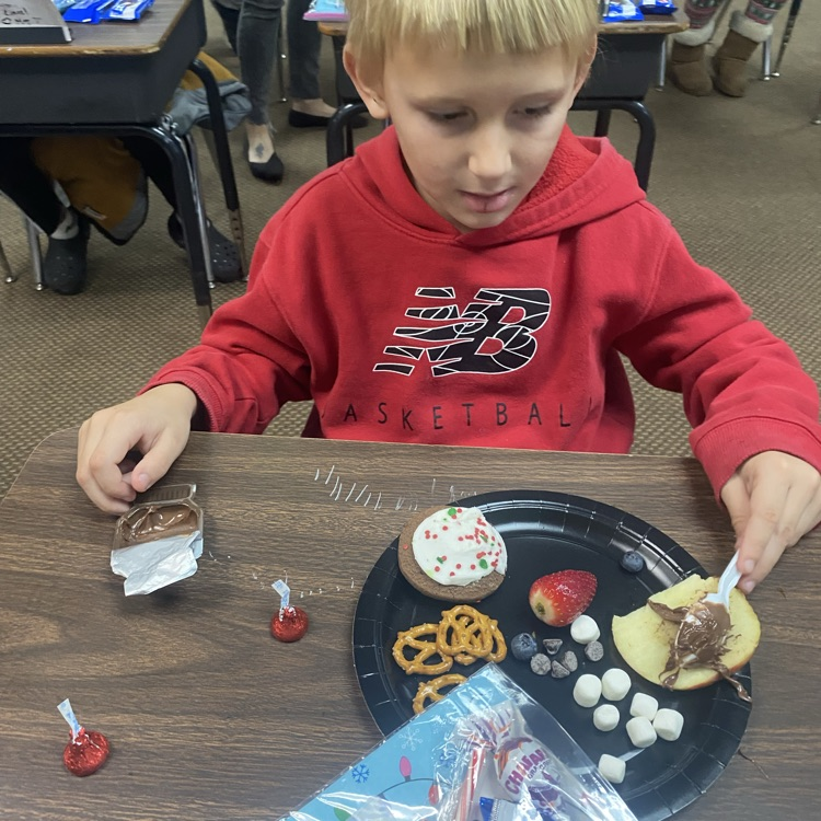 students making Rudolph snacks 