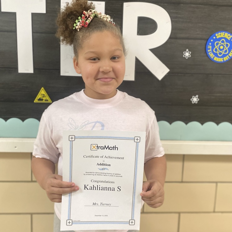 student holding a math certificate 