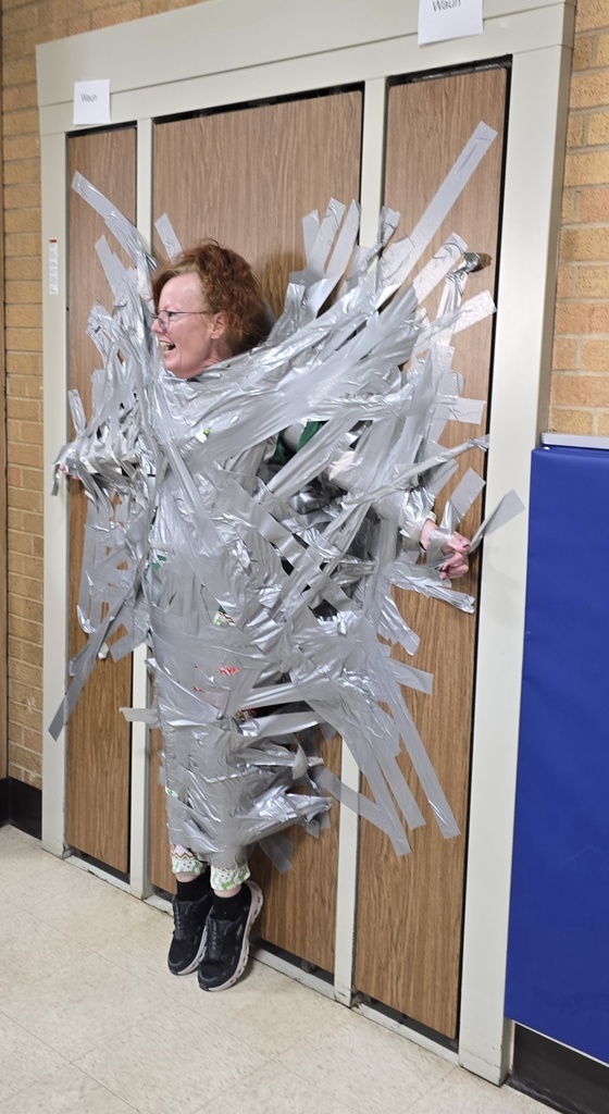 side angle of Mrs. Tierney who is taped to the wall