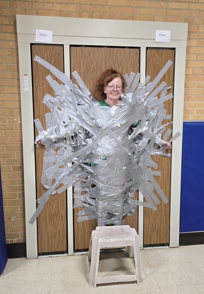Mrs. Tierney taped to a wall