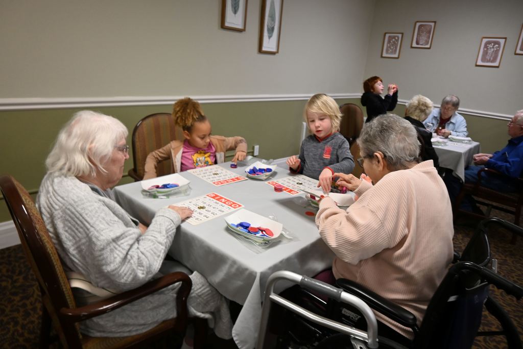 Students play BINGO with  Presby residents.