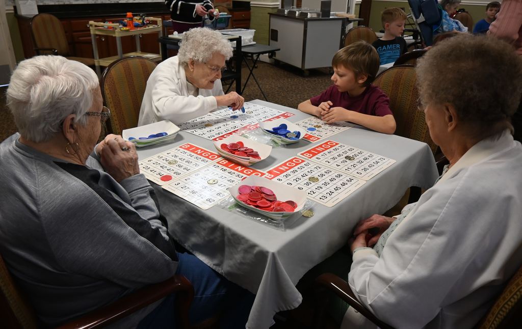 Students play BINGO with  Presby residents.