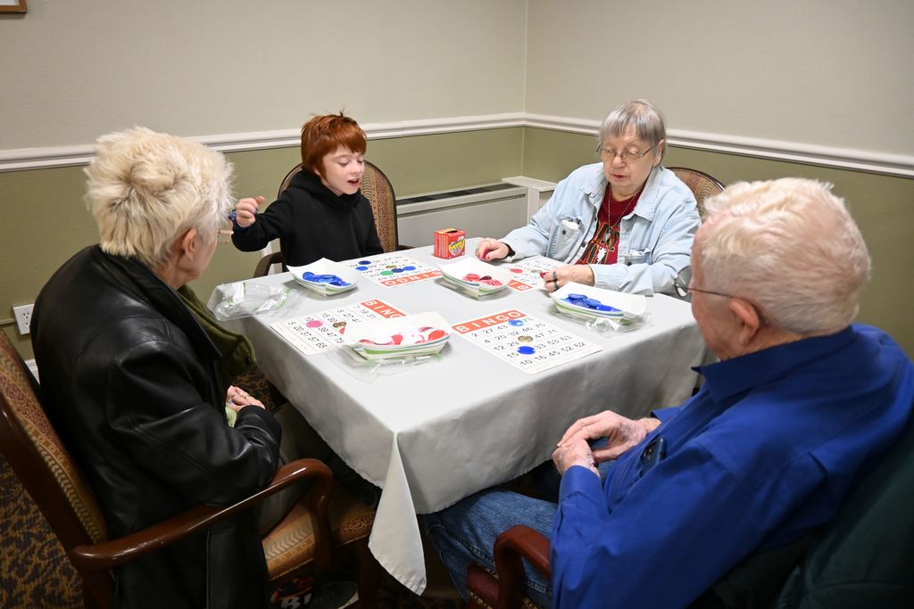 Students play BINGO with  Presby residents.