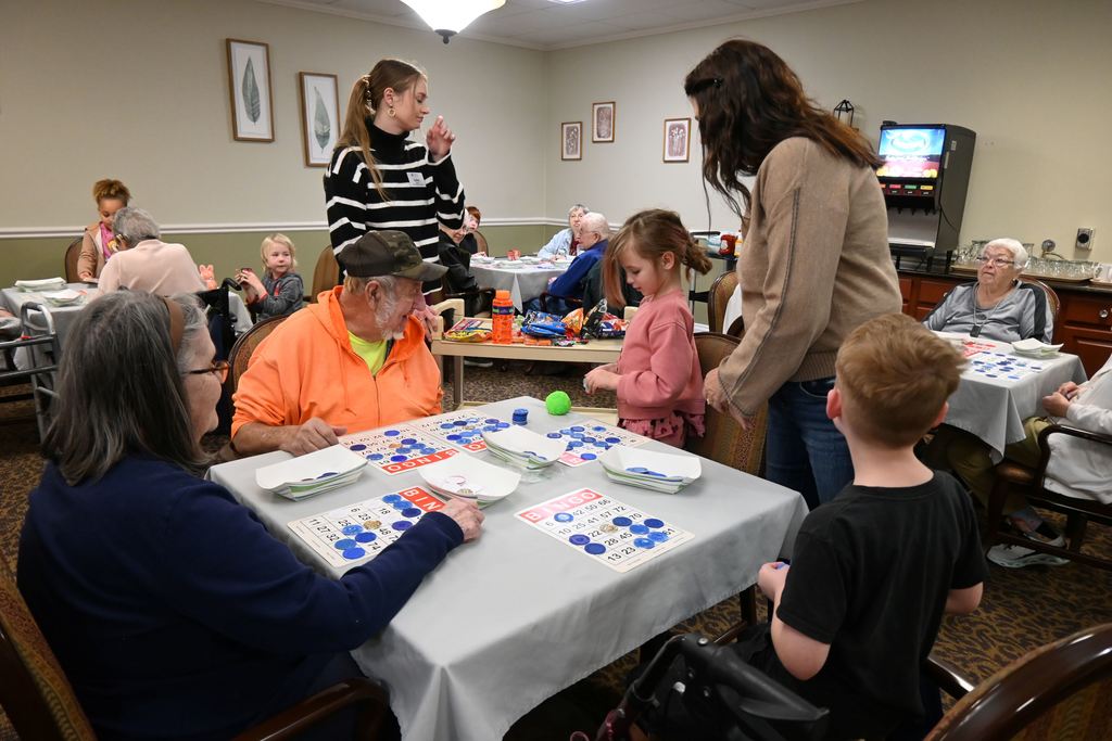 Students play BINGO with  Presby residents.