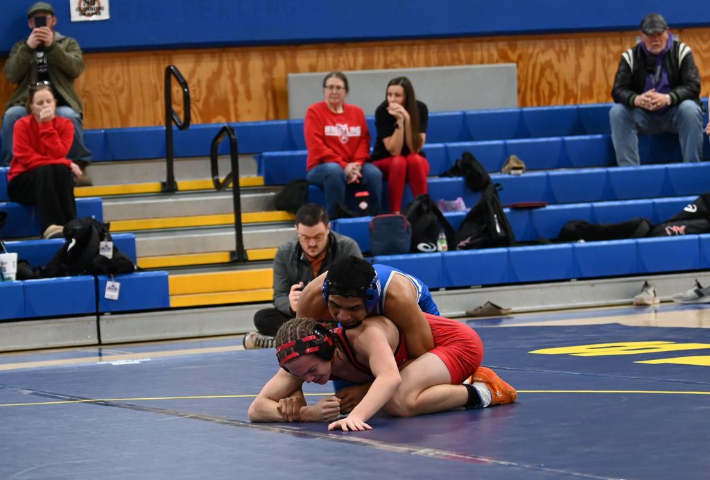 Young men from Parsons nd Erie wrestle.