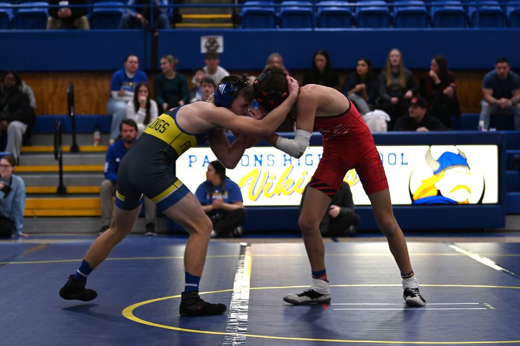 Young men from Parsons nd Erie wrestle.
