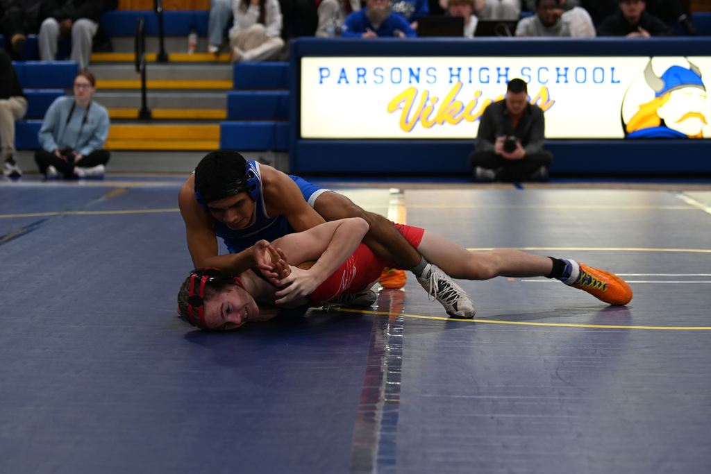 Young men from Parsons nd Erie wrestle.