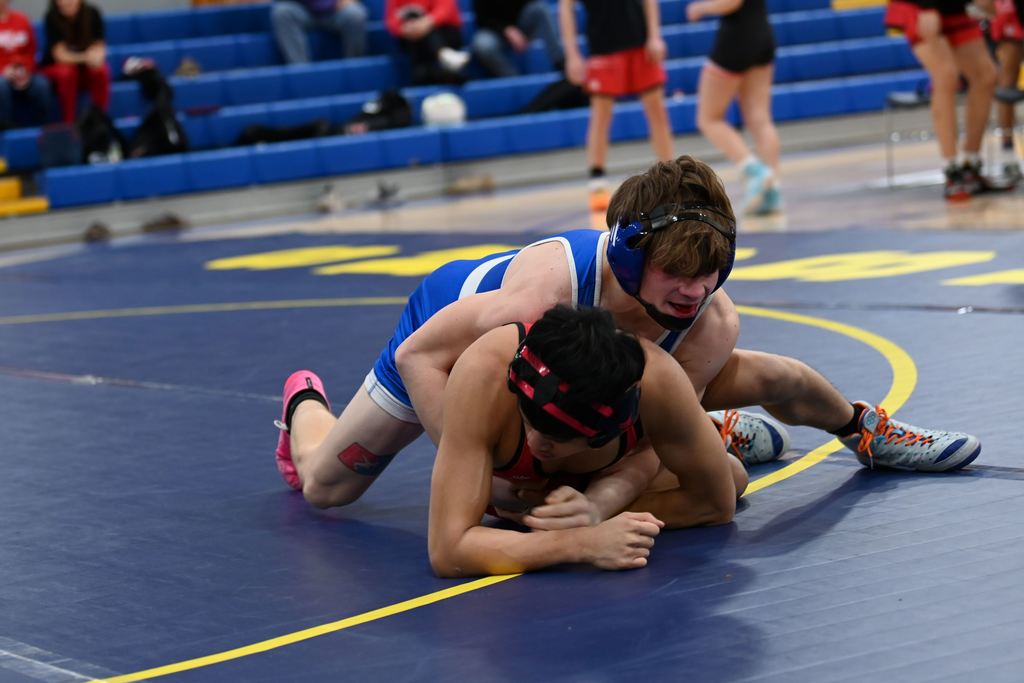 Young men from Parsons nd Erie wrestle.