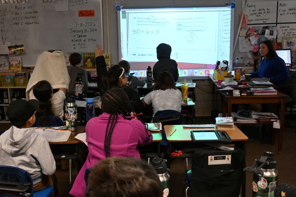 Students work on a math lesson with Mrs. Liska.