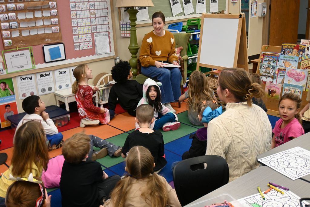 Board member Julie Legler reads to Mrs. Manley's class.