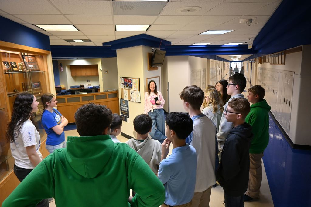 Kylie Lucas guides a tour of the high school main building.