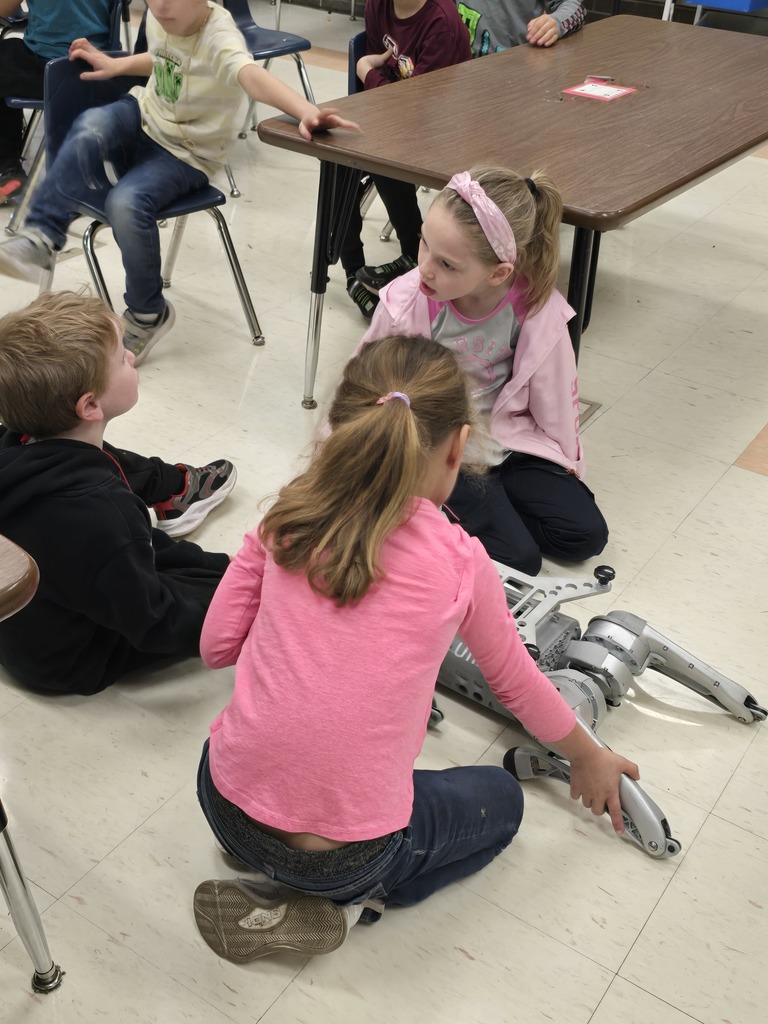 Students have a chance to touch Vector and analyze the different materials that make up the robot.