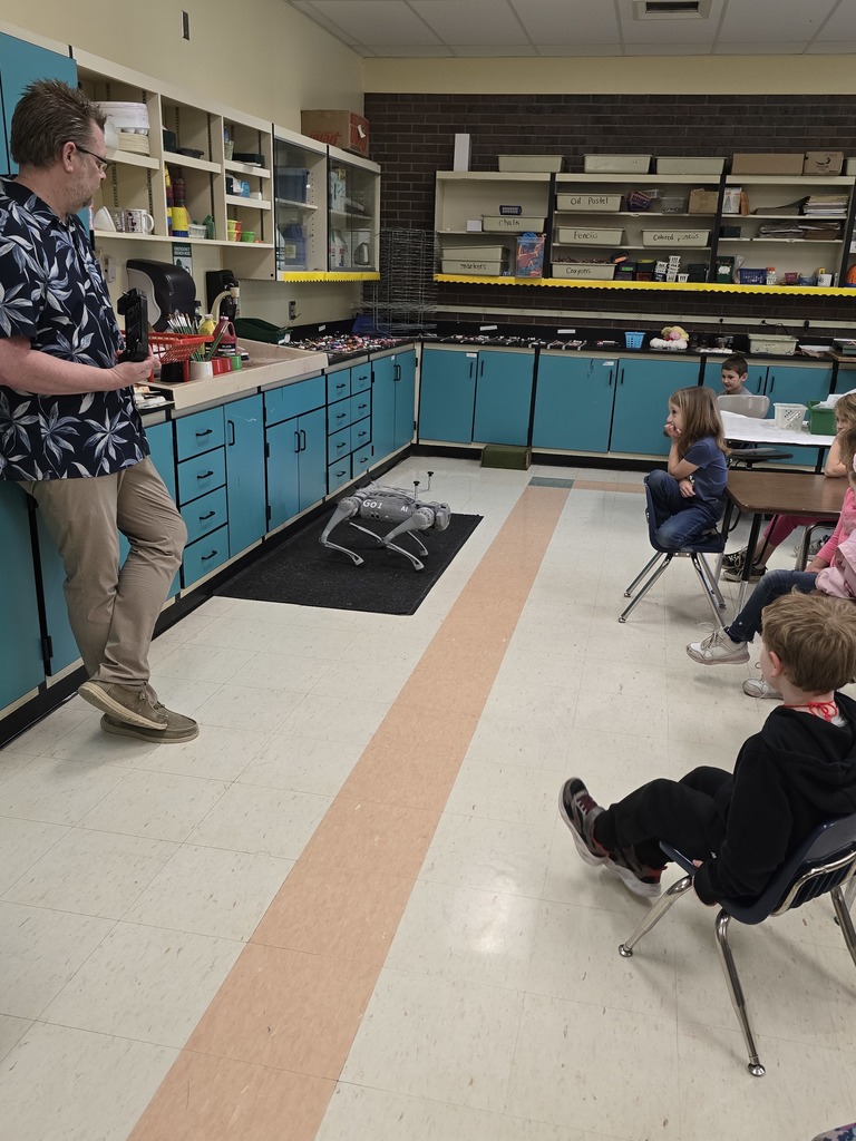 Students watch as Vector does a coded dance from memory.