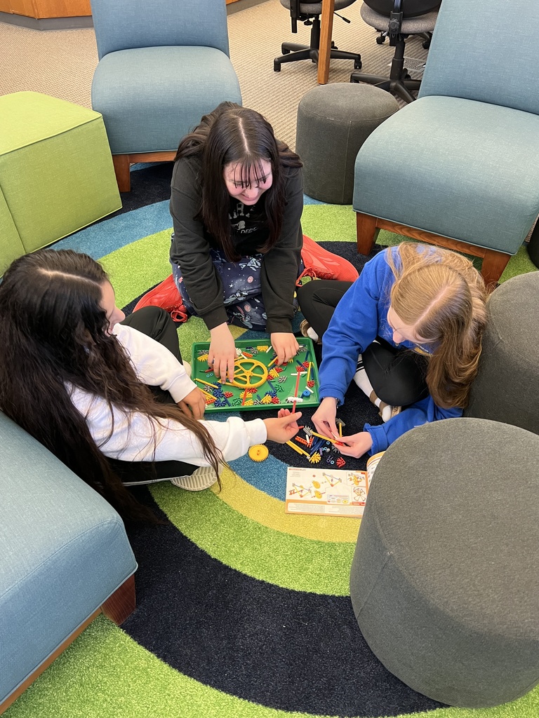 Girls working together to build with KNex.