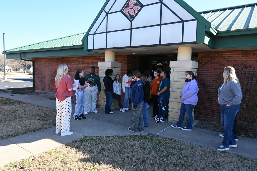 A group of 8th grade girls learn about the food and necessity pantry at LCC.