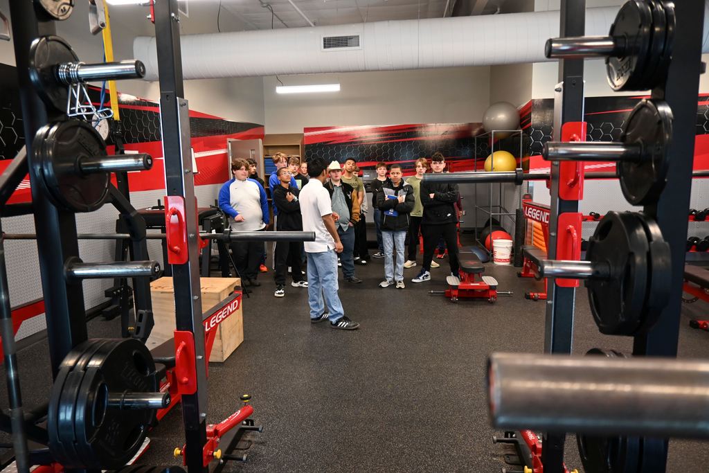 A group of eighth grade boys toure the LCC workout room.