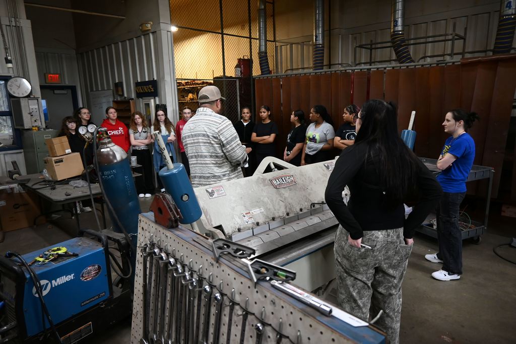 Students hear from Travis Brumback about welding class.