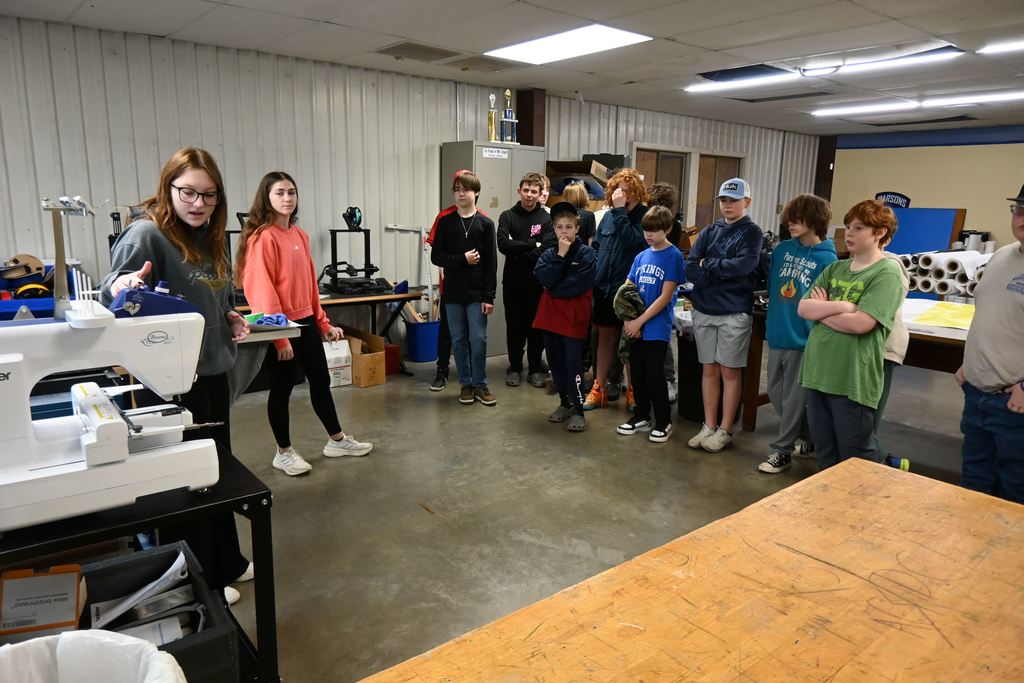 Students learn about embroidering clothes and screenprinting  t-shirts.
