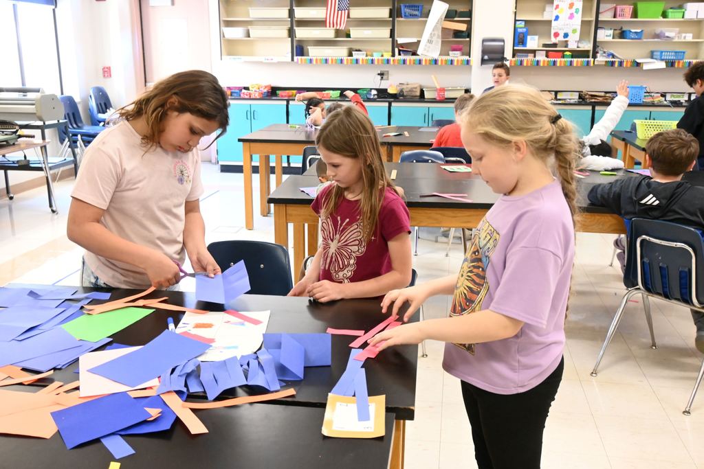 Stdents cut added strips of paper needed.