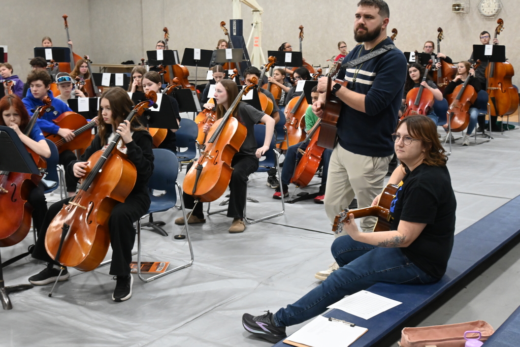 Two instructors joined in on acoustic guitars for Cielito Lindo.