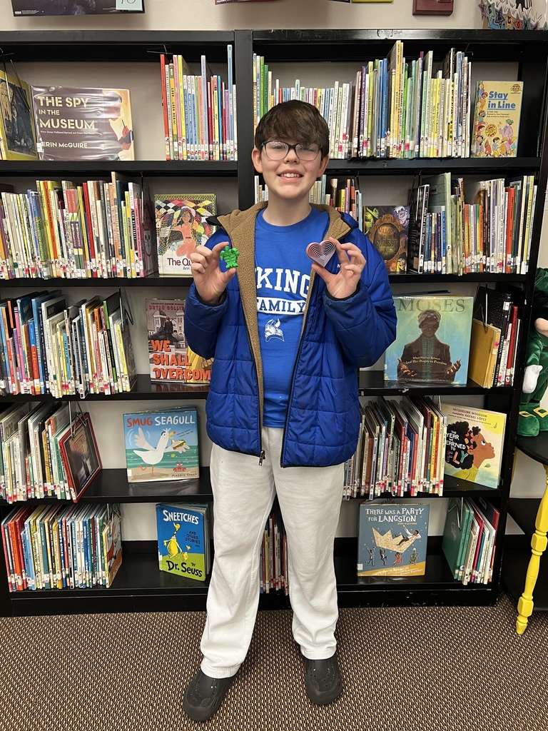 Student receives Beg. Review 2 prize.